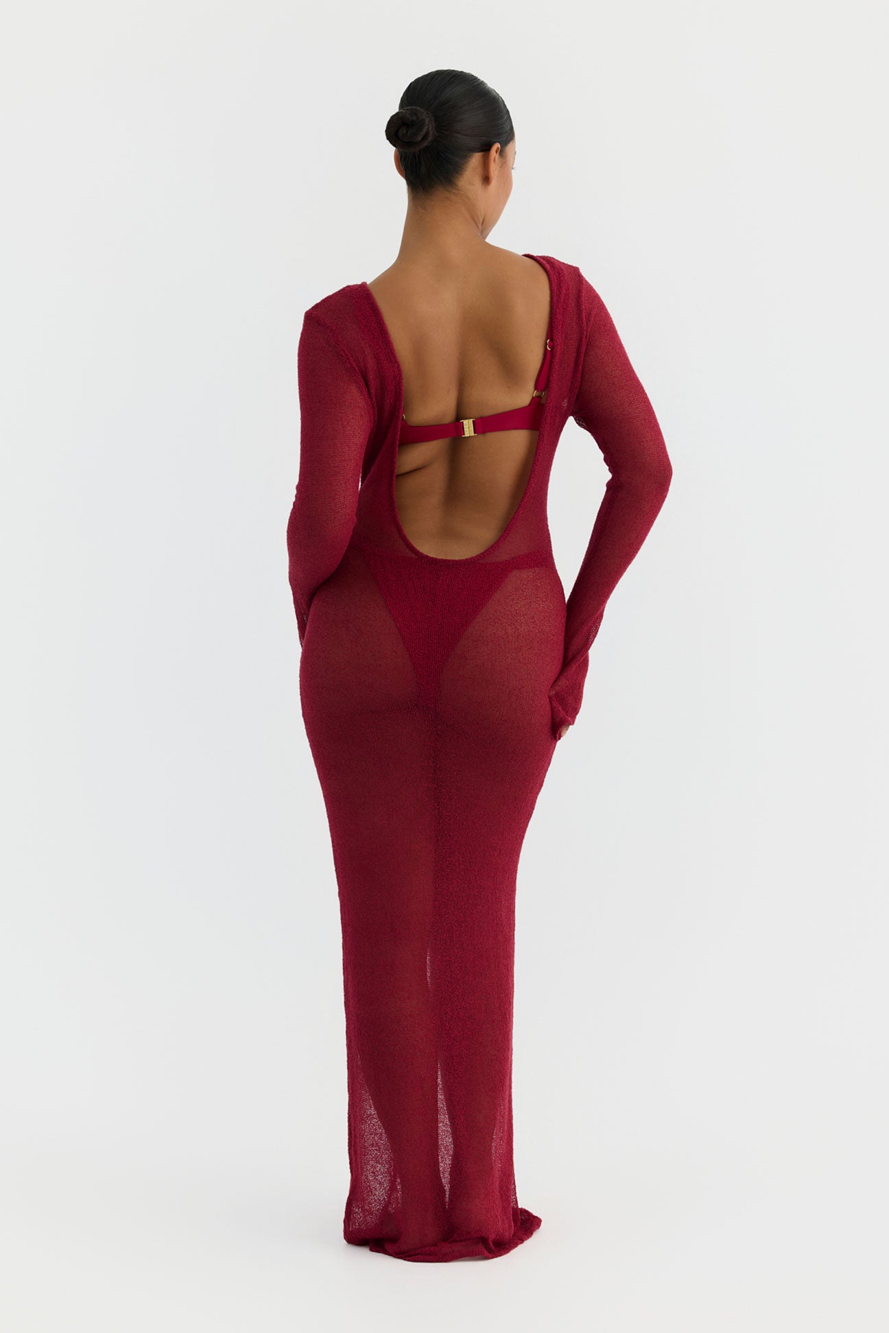 magenta dress with open back on a white background