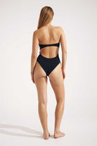 Person wearing a black bikini on a white background