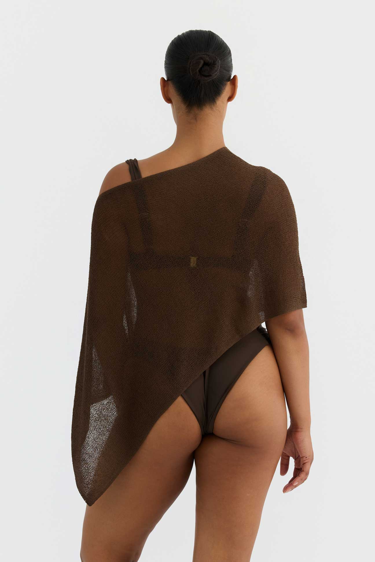 Brown off-shoulder garment worn by a person on a white background