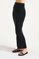 Black ribbed leggings worn by a person on a white background