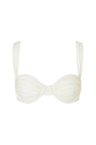 White bikini top with thin straps on a white background
