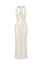 A sleeveless, bodycon maxi dress in a textured cream or off-white knit fabric, featuring a racerback-style neckline with a small cutout at the top center, shown against a plain white background.