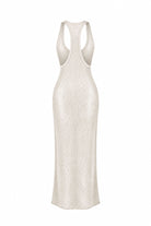 A sleeveless, backless maxi dress in a textured cream or off-white fabric, shown from the back against a plain white background.