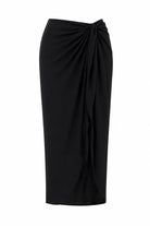 Black draped skirt on a white background