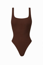 Brown swimsuit with thin straps on a white background
