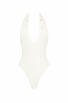 White swimsuit with thin straps on a white background