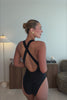 Model wearing the Tove One Piece in Black,
