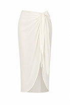 An off-white wrap midi skirt with a knotted waist and draped front detail, shown against a plain white background.