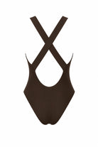 A dark brown one-piece swimsuit shown from the back, featuring crossed shoulder straps and a scoop neckline, set against a plain white background.